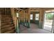 Unfinished interior with staircase, stud walls, and exterior door visible at 91 Caspian Ct, Lillington, NC 27546