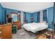 Spacious bedroom featuring hardwood floors, natural light from the windows, and a dresser with mirror at 940 Hill St, Rocky Mount, NC 27801