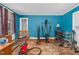 Bedroom space featuring hardwood floors, a bed frame, natural light, and some exercise equipment at 940 Hill St, Rocky Mount, NC 27801