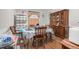 Cozy dining area featuring wood floors, a classic china cabinet, and a four-chair table setting at 940 Hill St, Rocky Mount, NC 27801