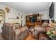Comfortable living area featuring hardwood floors, ample seating, and decorative fireplace at 940 Hill St, Rocky Mount, NC 27801