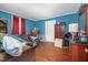 Cozy living room with hardwood floors, a comfortable couch, natural light, and various storage options at 940 Hill St, Rocky Mount, NC 27801