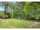 Spacious backyard showing the storage shed at 9509 Greenfield Dr, Raleigh, NC 27615