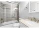 Bright bathroom with a tiled shower/tub combo, a modern sink, and neutral color scheme at 9509 Greenfield Dr, Raleigh, NC 27615