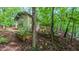 Backyard view with multi-level decks, including an outdoor kitchen, offering many spots to enjoy the natural landscape at 1 Davie Ln, Chapel Hill, NC 27514