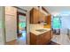 Kitchen with stainless steel appliances, ample cabinet space, and hardwood floors at 1 Davie Ln, Chapel Hill, NC 27514