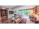 Cozy living room with fireplace and sliding doors to the outdoors at 1 Davie Ln, Chapel Hill, NC 27514