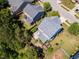 An aerial view shows a home with well-maintained landscaping and a quaint patio area at 1004 Bridlemine Dr, Fuquay Varina, NC 27526