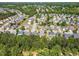 High-angle view of houses in a leafy suburban setting, perfect for Gathering living at 1004 Bridlemine Dr, Fuquay Varina, NC 27526