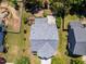Overhead view of a home showcasing backyard with stone patio, landscaping, and a fenced area at 1004 Bridlemine Dr, Fuquay Varina, NC 27526