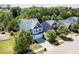 Lovely aerial view showcasing a well-kept two-story home with a driveway in a serene, green community at 1004 Bridlemine Dr, Fuquay Varina, NC 27526