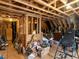 Unfinished attic space with wooden beams, offering potential for storage or renovation at 1004 Bridlemine Dr, Fuquay Varina, NC 27526