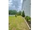 Expansive backyard featuring green lawn, white picket fence, and well-maintained landscaping at 1004 Bridlemine Dr, Fuquay Varina, NC 27526