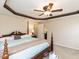 Bedroom features a ceiling fan and decorative ceiling trim at 1004 Bridlemine Dr, Fuquay Varina, NC 27526
