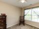 Cozy bedroom featuring a rocking chair near the window and a classic wooden dresser at 1004 Bridlemine Dr, Fuquay Varina, NC 27526