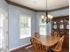 Bright dining room with wood floors, chandelier, and built-in hutch perfect for entertaining at 1004 Bridlemine Dr, Fuquay Varina, NC 27526