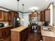 Modern kitchen with stainless steel appliances, granite countertops, and a functional island at 1004 Bridlemine Dr, Fuquay Varina, NC 27526
