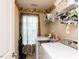 Functional laundry room featuring machines, storage shelves, and a window for natural light at 1004 Bridlemine Dr, Fuquay Varina, NC 27526