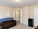 Comfortable living space with a couch, mini-fridge, and neutral carpet at 1004 Bridlemine Dr, Fuquay Varina, NC 27526