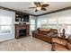 Comfortable living room featuring a fireplace and a large television at 1004 Bridlemine Dr, Fuquay Varina, NC 27526