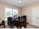 Dedicated office space with a large window, spacious desk, and comfortable seating for productivity at 1004 Bridlemine Dr, Fuquay Varina, NC 27526