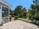 Outdoor patio area with a view of landscaped backyard and lush trees at 1004 Bridlemine Dr, Fuquay Varina, NC 27526