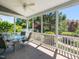 Screened-in porch with ceiling fan and outdoor furniture for relaxing and entertaining at 1004 Bridlemine Dr, Fuquay Varina, NC 27526