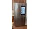 Stainless steel Samsung refrigerator with four doors, including an integrated screen that displays the inside of the fridge at 1004 Bridlemine Dr, Fuquay Varina, NC 27526