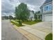 Neighborhood street with well-maintained lawns and homes in a suburban setting at 1004 Bridlemine Dr, Fuquay Varina, NC 27526
