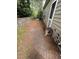 Home exterior featuring a brick patio, partial retaining wall and AC unit at 1017 Red Hat Ln, Durham, NC 27713