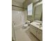 Full bathroom featuring a tub shower combo, toilet and a single sink vanity at 1017 Red Hat Ln, Durham, NC 27713