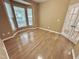 Bright bedroom with hardwood floors, bay window and French doors at 1017 Red Hat Ln, Durham, NC 27713