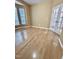 Sunlit bedroom with hardwood floors and French doors at 1017 Red Hat Ln, Durham, NC 27713