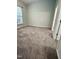 Cozy bedroom with neutral-toned walls and carpeting at 1017 Red Hat Ln, Durham, NC 27713