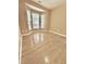 Bright bedroom with hardwood floors and a bay window at 1017 Red Hat Ln, Durham, NC 27713