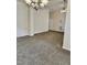 Bright, open living room featuring high ceilings and neutral carpet at 1017 Red Hat Ln, Durham, NC 27713