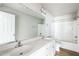 Bright bathroom with double sink vanity, large mirror, and shower-tub combo at 103 Hampshire Pl, Kenly, NC 27542