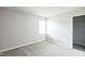 Cozy bedroom with neutral walls, a window, and a closet for ample storage at 103 Hampshire Pl, Kenly, NC 27542