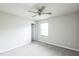 Bright bedroom with a ceiling fan and neutral walls, perfect for relaxation at 103 Hampshire Pl, Kenly, NC 27542