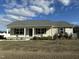 Charming single-story home with welcoming front porch and well-maintained landscaping at 103 Hampshire Pl, Kenly, NC 27542