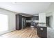 Stylish kitchen featuring stainless steel appliances, granite countertops, and dark wood cabinets at 103 Hampshire Pl, Kenly, NC 27542