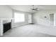 Inviting living room featuring a fireplace, ceiling fan, and a front door at 103 Hampshire Pl, Kenly, NC 27542
