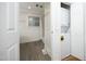 Full bathroom and laundry closet featuring neutral walls and coordinated design at 106 E Club Blvd, Durham, NC 27704