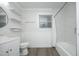 Clean bathroom featuring white vanity, updated fixtures, and marble-look shower at 106 E Club Blvd, Durham, NC 27704