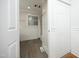 Bright bathroom features wood-look flooring, shower-tub combo, and white beadboard paneling at 106 E Club Blvd, Durham, NC 27704