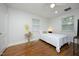 Bright bedroom with hardwood floors, neutral colors, and natural light from windows at 106 E Club Blvd, Durham, NC 27704
