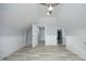 Spacious bonus room boasts wood-look flooring, beadboard paneling, and an adjacent bath at 106 E Club Blvd, Durham, NC 27704