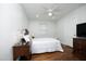 Cozy bedroom with hardwood floors, ceiling fan, and ample closet space at 106 E Club Blvd, Durham, NC 27704