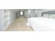 Bright bedroom with neutral carpet, gray walls, a window AC unit, and a decorative headboard at 106 E Club Blvd, Durham, NC 27704