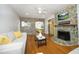 Spacious living room flowing into the dining area, featuring hardwood floors and stone accents at 106 E Club Blvd, Durham, NC 27704